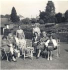 Front L-R: Meg Kelman, Ina Wallace, Makie Sutherland, Dora Rettie, Mary Whyte, Mrs Cowie, Beldie Friars. Back: Mrs Smith and ??.