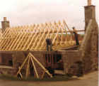 Geordie Duthie, joiner putting on a new roof at 114 High Street New Pitsligo